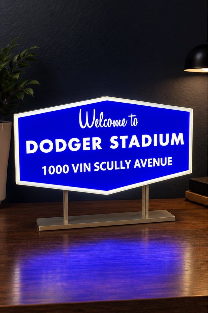 Lit blue 'Welcome to Dodger Stadium' lightbox on a desk